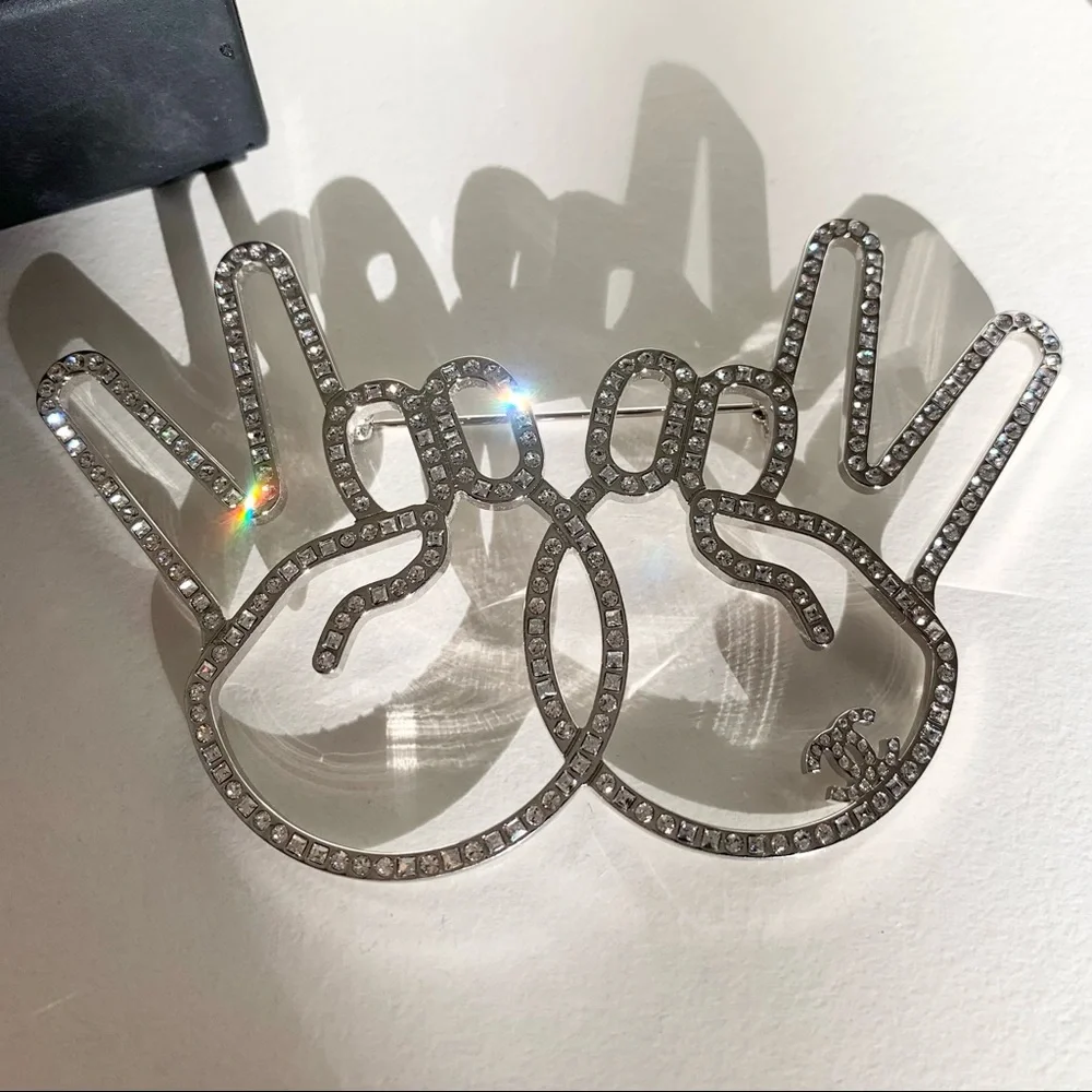 Chanel large peace hands pin